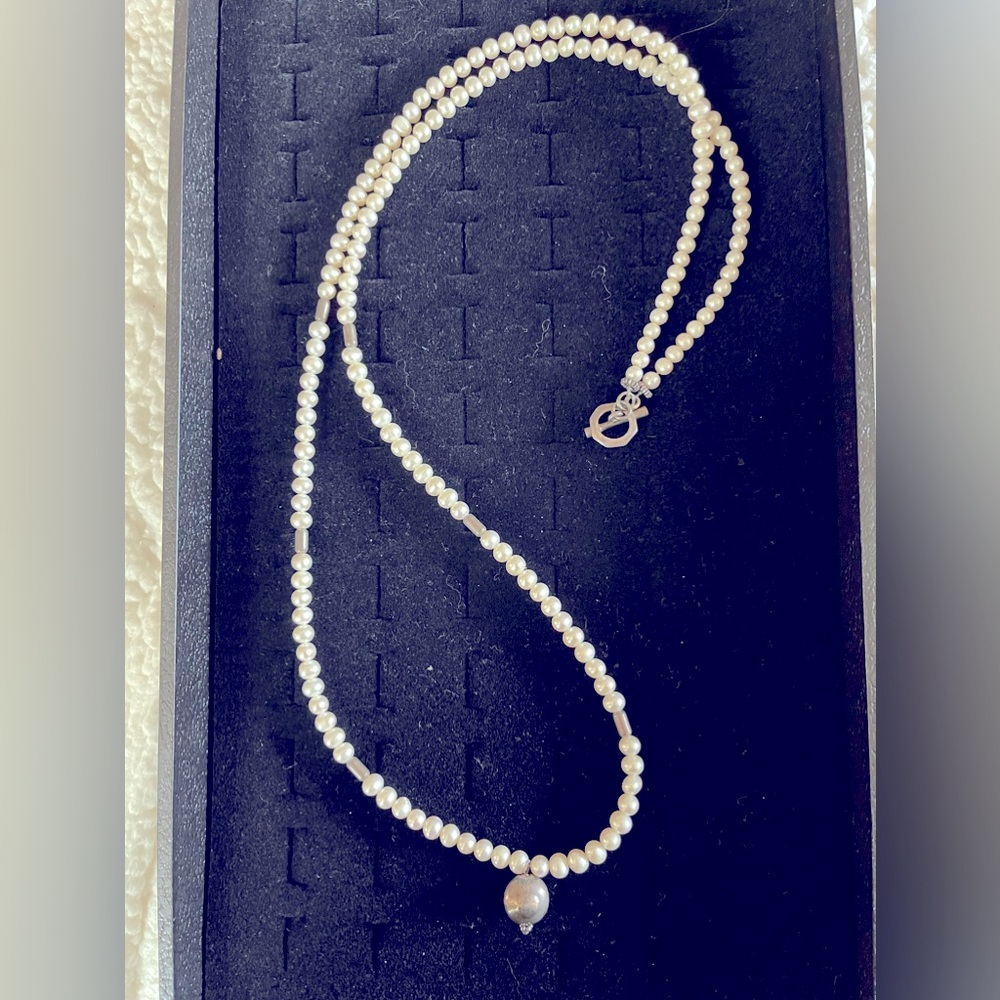 Fresh water pearl necklace with sterling silver accents.